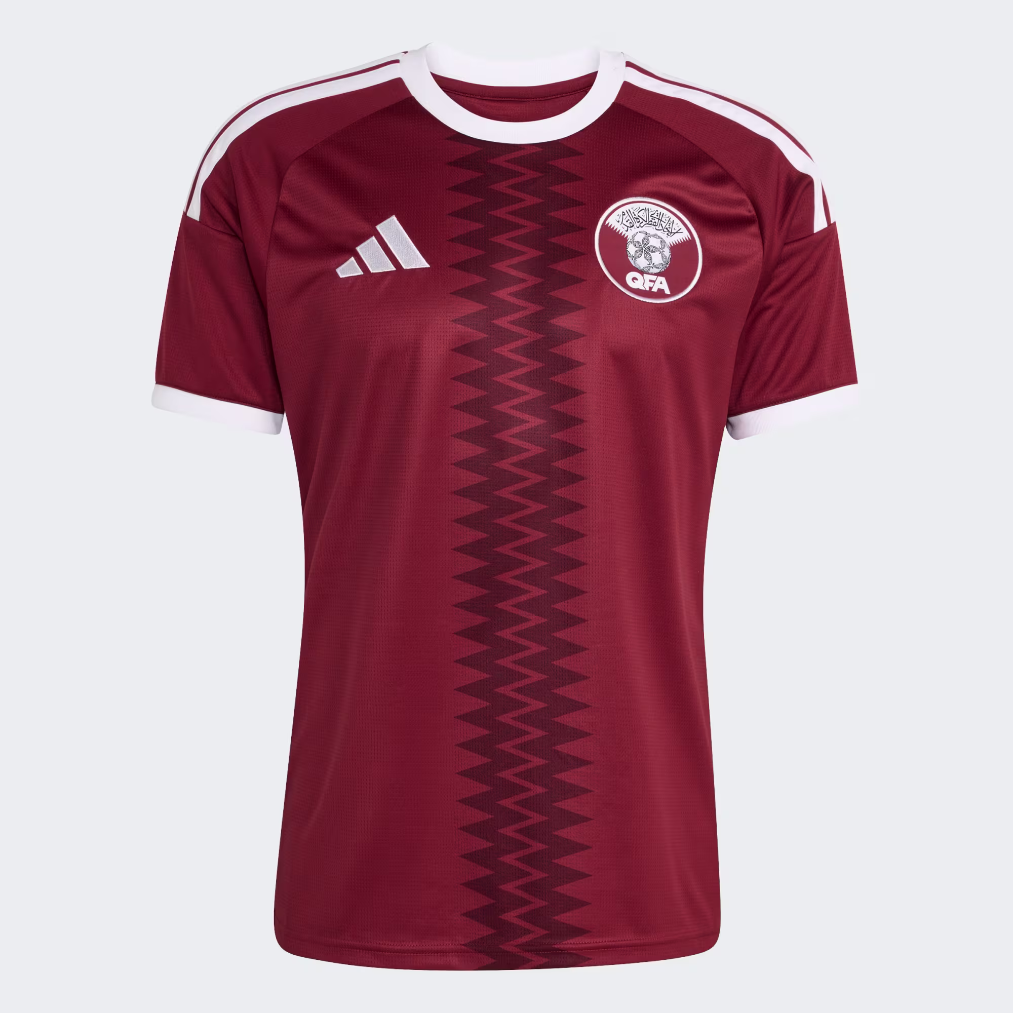 Deep maroon · Arabic ‘Qatar’ neck · national identity